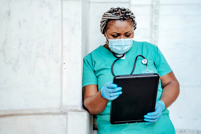 professional nurse reading a table
