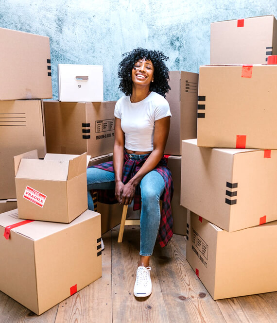 woman packing her moving boxes