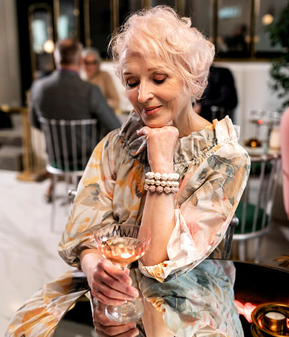 beautiful aging woman with a dress in the city