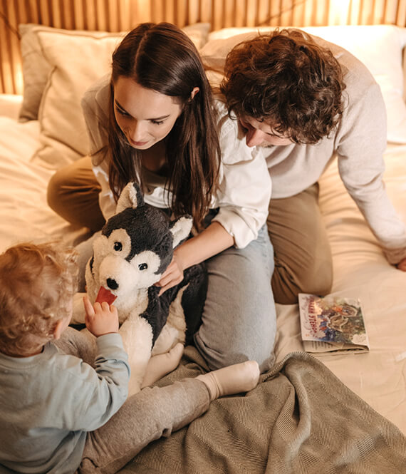 new family playing with their child