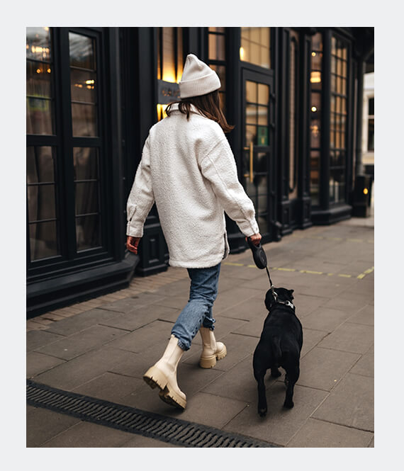 woman walking with mental service dog