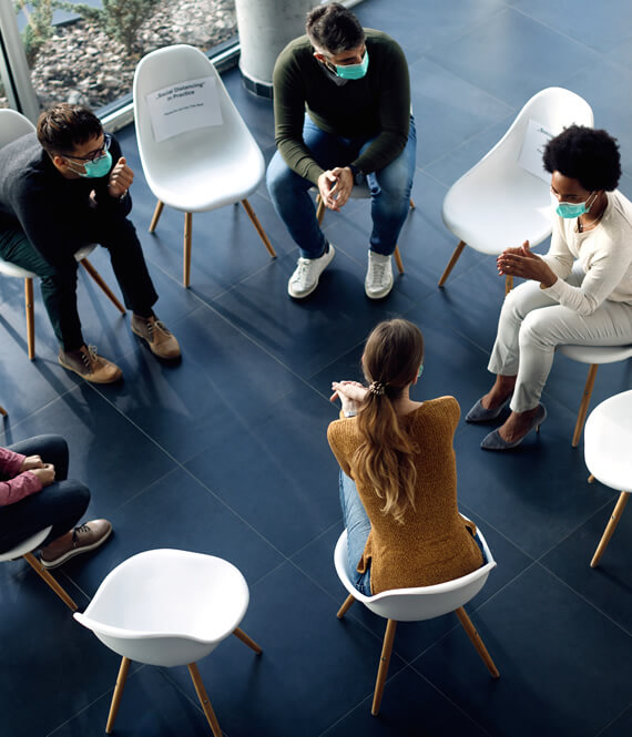 people sitting in recovery support group