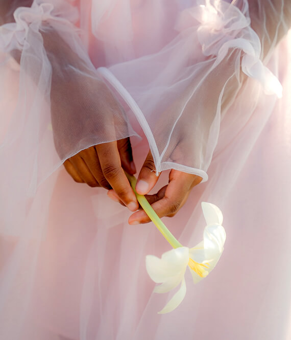 woman holding a flower to be mindful, one of the mindfulness activities for adults