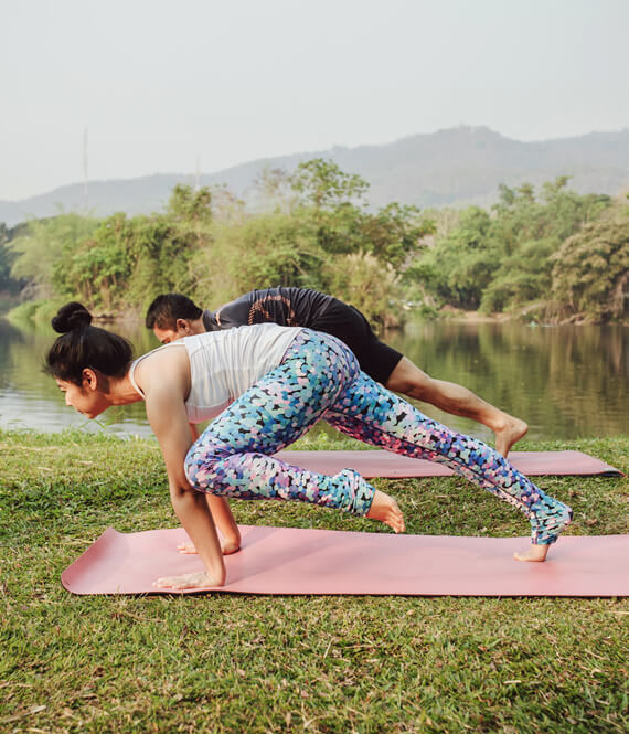 people enjoying benefits of sweating by doing yoga