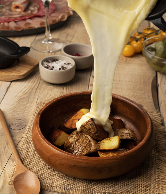 melting raclette on a swiss meal