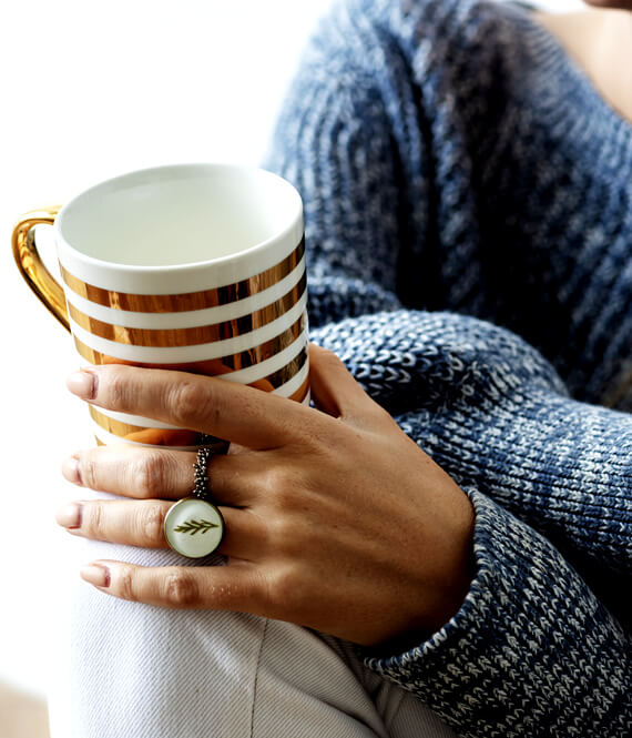 woman holding a cup of tea
