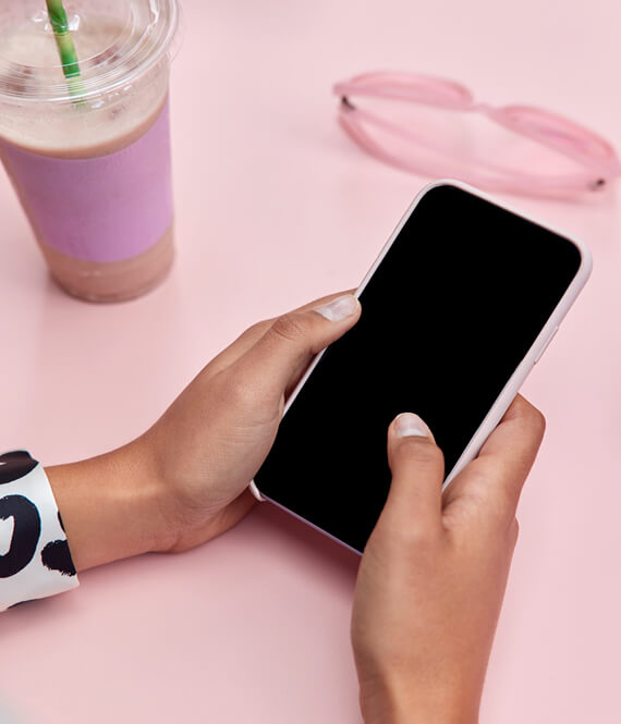 woman using her phone to earn passive income