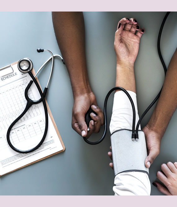nurse checking blood pressure