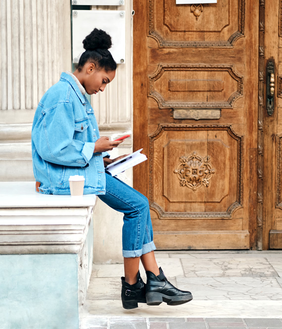 woman studying books about personal development