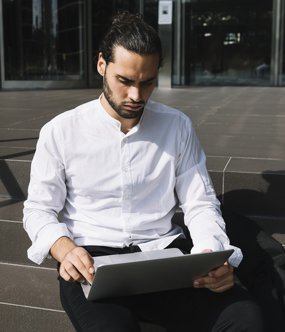 entrepreneur small business owner working on his laptop