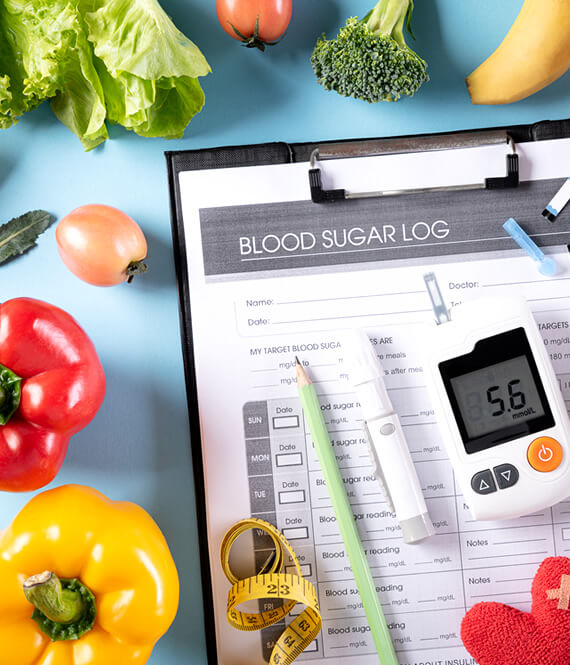 blood sugar log and vegetables on the table