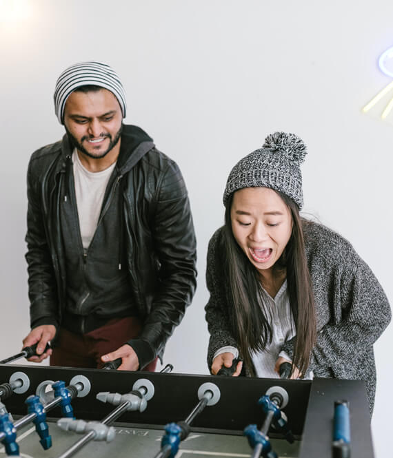 friends playing foosball together