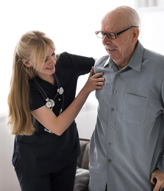 nursing home nurse taking care of an elderly patient