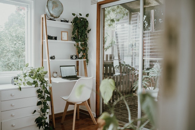 scandi style office room with a lot of plants
