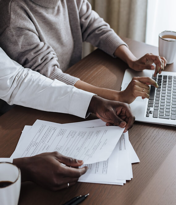 two people looking at high energy bills stressed out