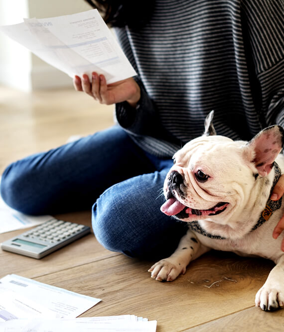 young adult sorting out pile of bills