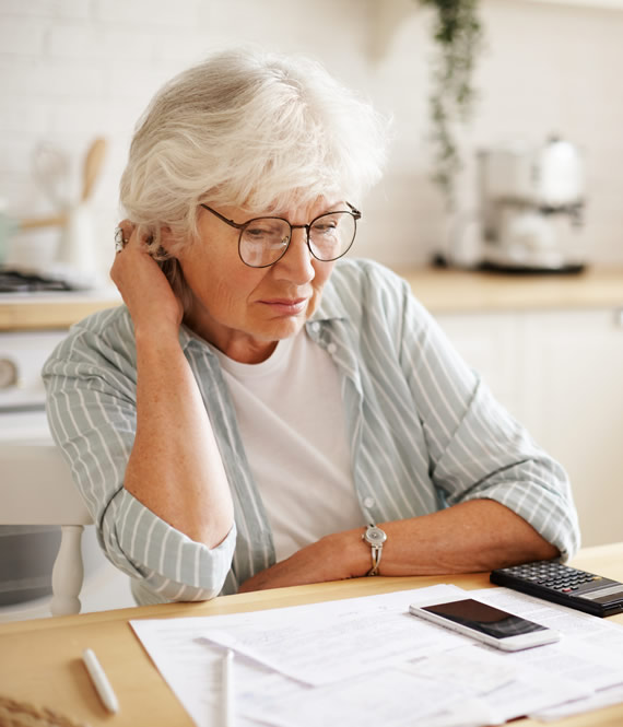 elderly woman experiencing financial stress