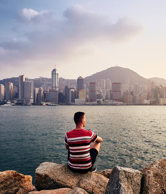 man experiencing loneliness when travelling alone in hong kong