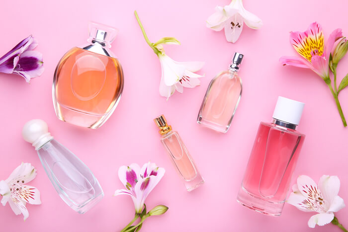 various perfume bottles with flowers