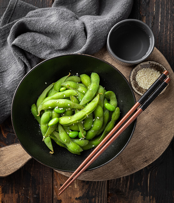 edamame beans chopsticks and sesame