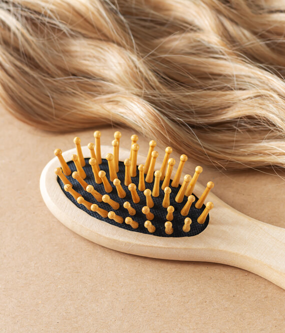 hair brush as a symbol to combat hair loss