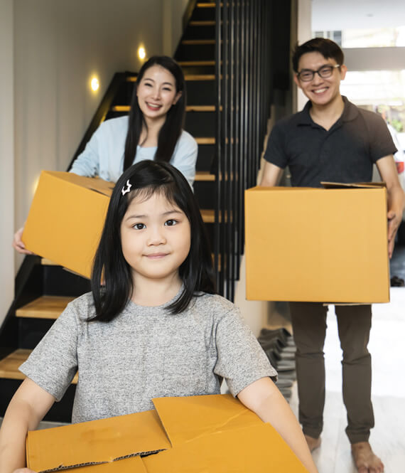 happy family moving with kids to other home