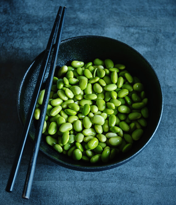 lightly cooked edamame beans in a bowl