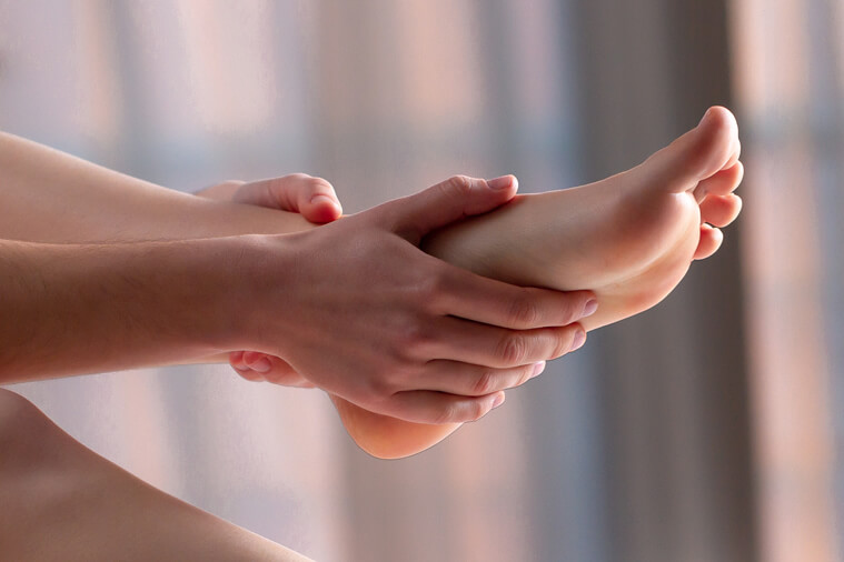 massaging painful feet