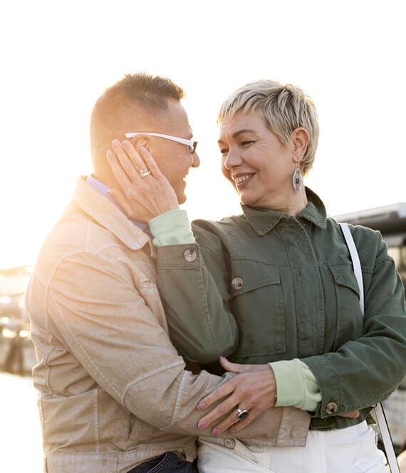 middle age couple hugging after getting vasectomy explained to them