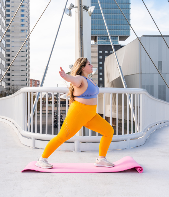 beautiful young woman exercising outdoors