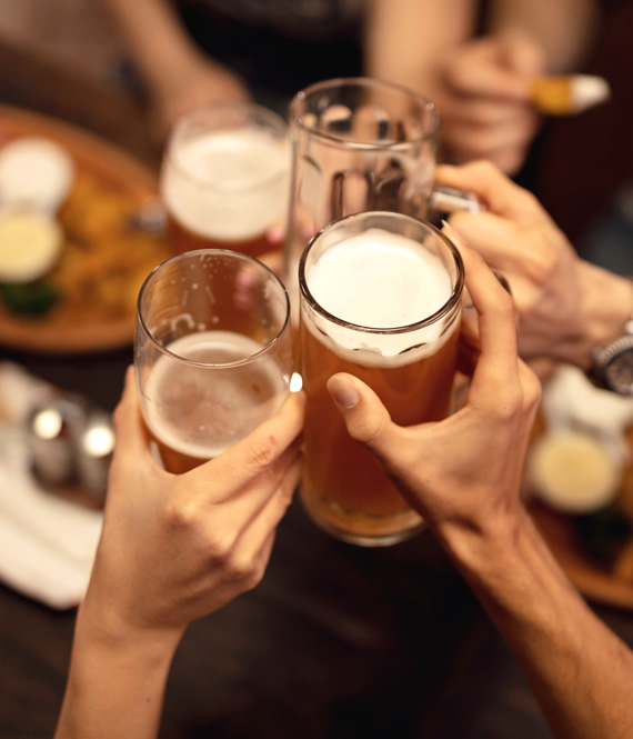 group of friends toasting with drinks