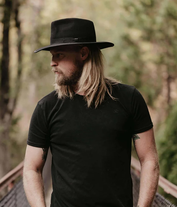 man wearing vintage mens hats for photoshoot