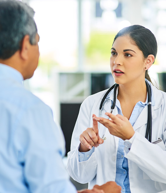 person talking about in person rehab options with his doctor