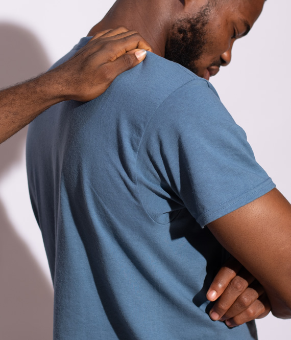 person with mental health struggles experiencing back pain