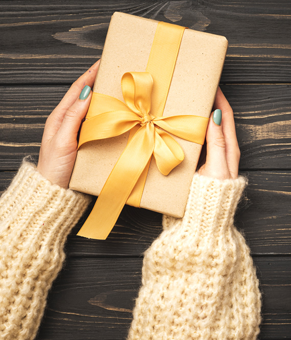 person holding fathers day gifts