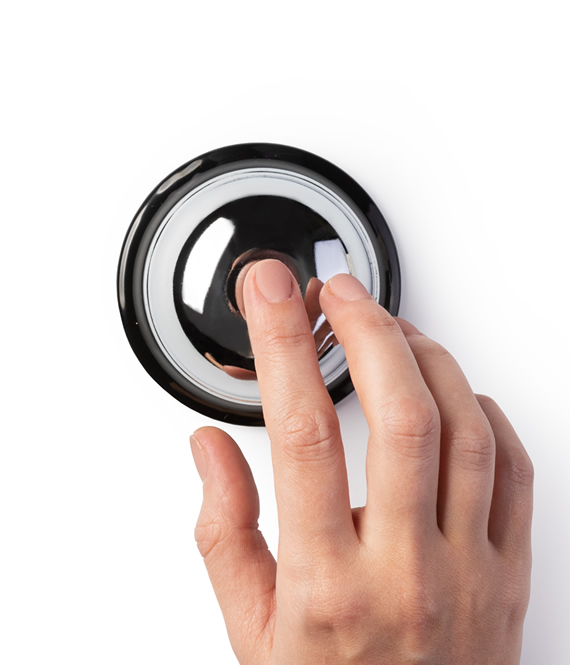 person pressing medical alert devices button