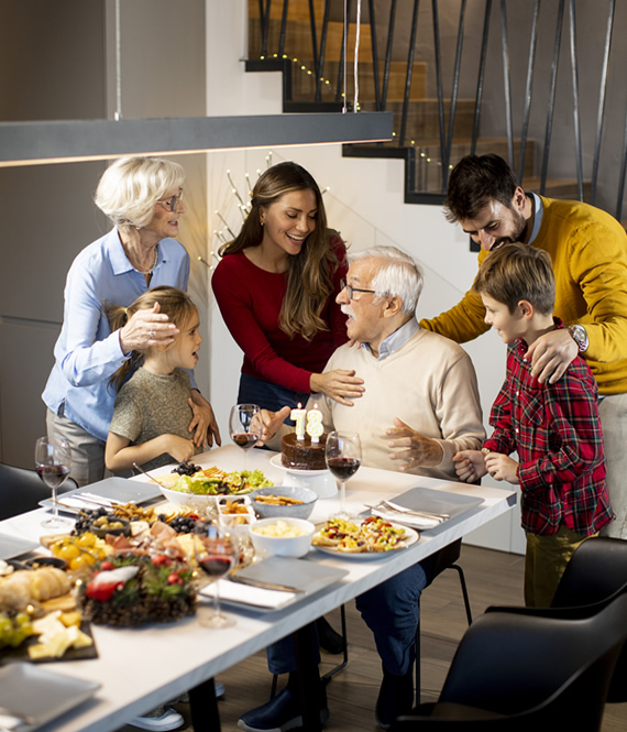 big happy family eating together to foster essential family values