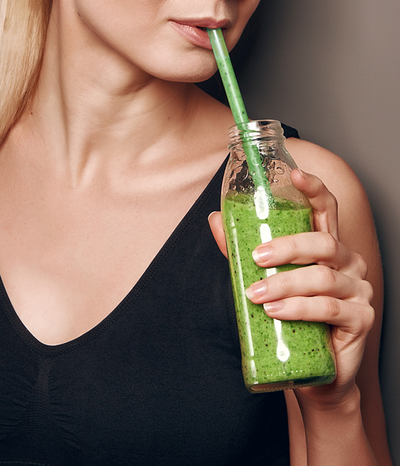 healthy lifestyle advocate drinks green smoothie nutritional cleanse drink