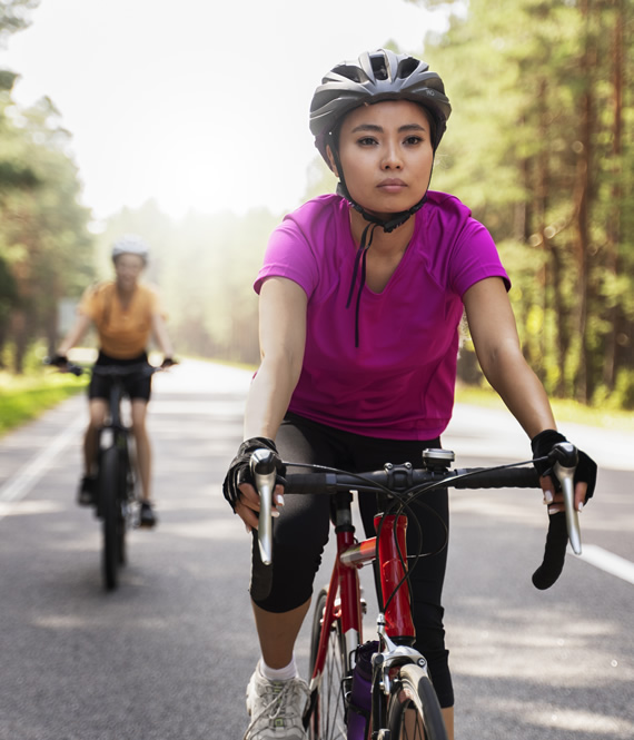 two women cycling for weight loss