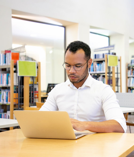adult person studying in a library