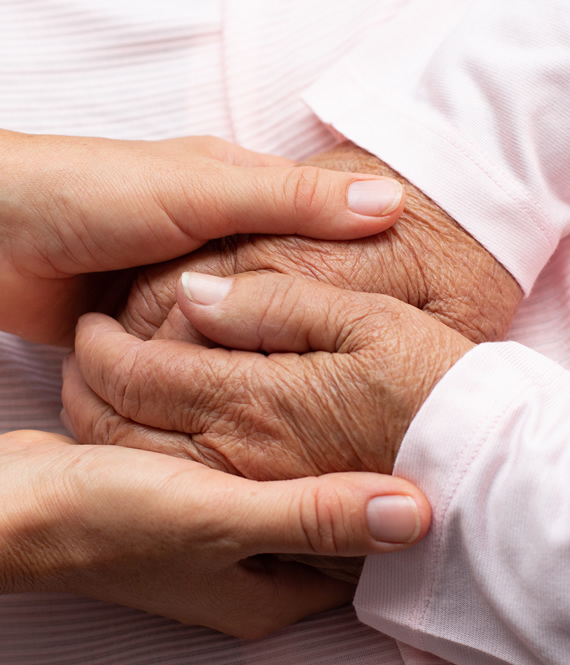 end of life support holding hands