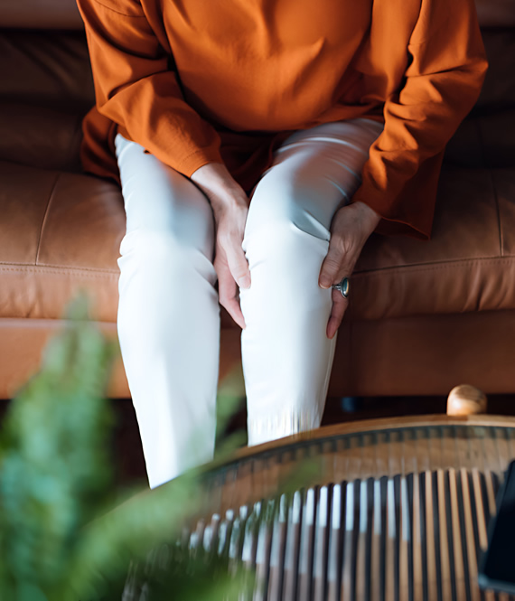 person experiences pain in their legs