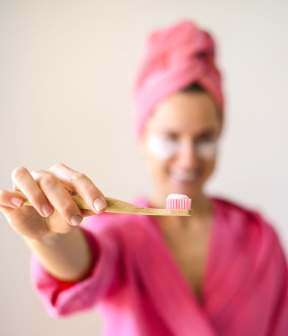 person shows oral hygiene essentials