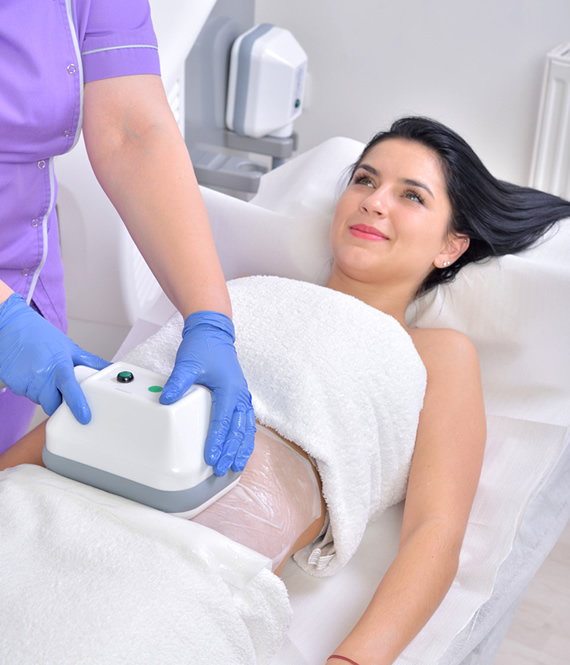 woman receives a cryolipolysis procedure