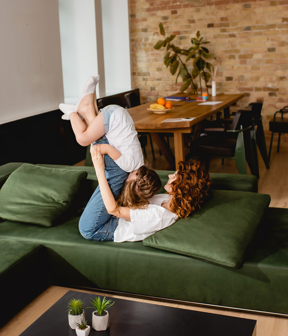 mom plays with her daughter in a stylish kid-friendly room