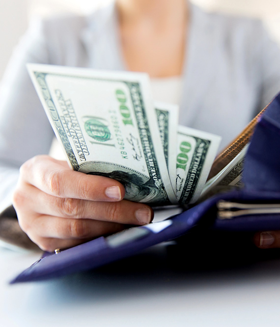 woman counts dollars after using realistic ways to make extra money