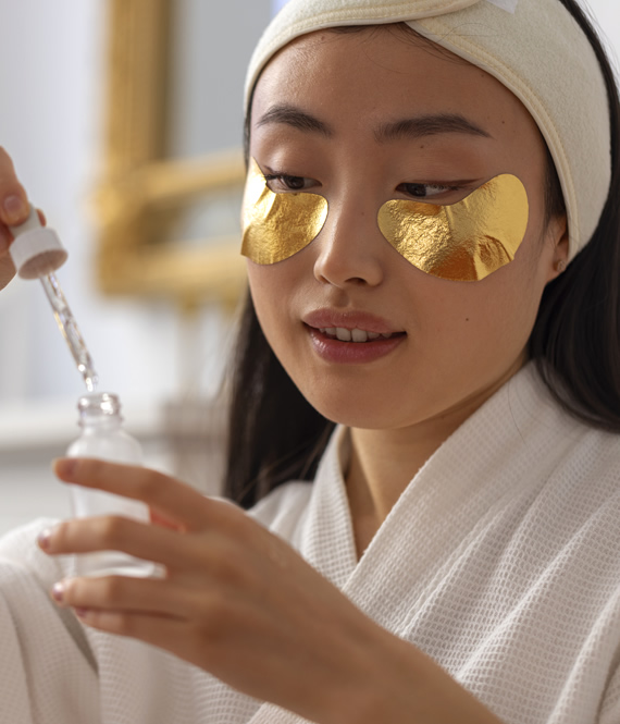 woman uses anti-puffiness face products