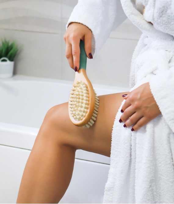 Person dry brushing their body