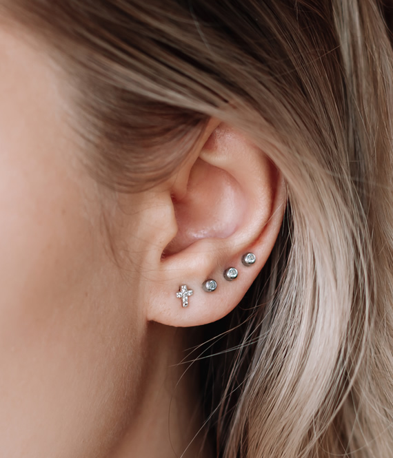 person with new pretty ear piercings