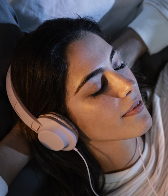 woman sleeps with headphones